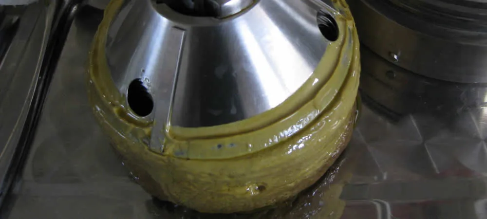 Alfa Laval disc stack centrifuge clogged bowl — solids accumulation in the disc stack and sludge space