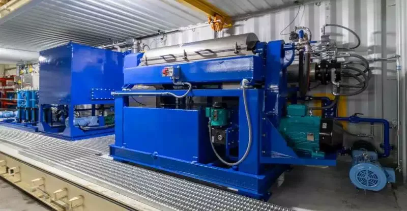 Containerized Crude Oil Recovery System housed in a prefabricated shipping container with all three process stages