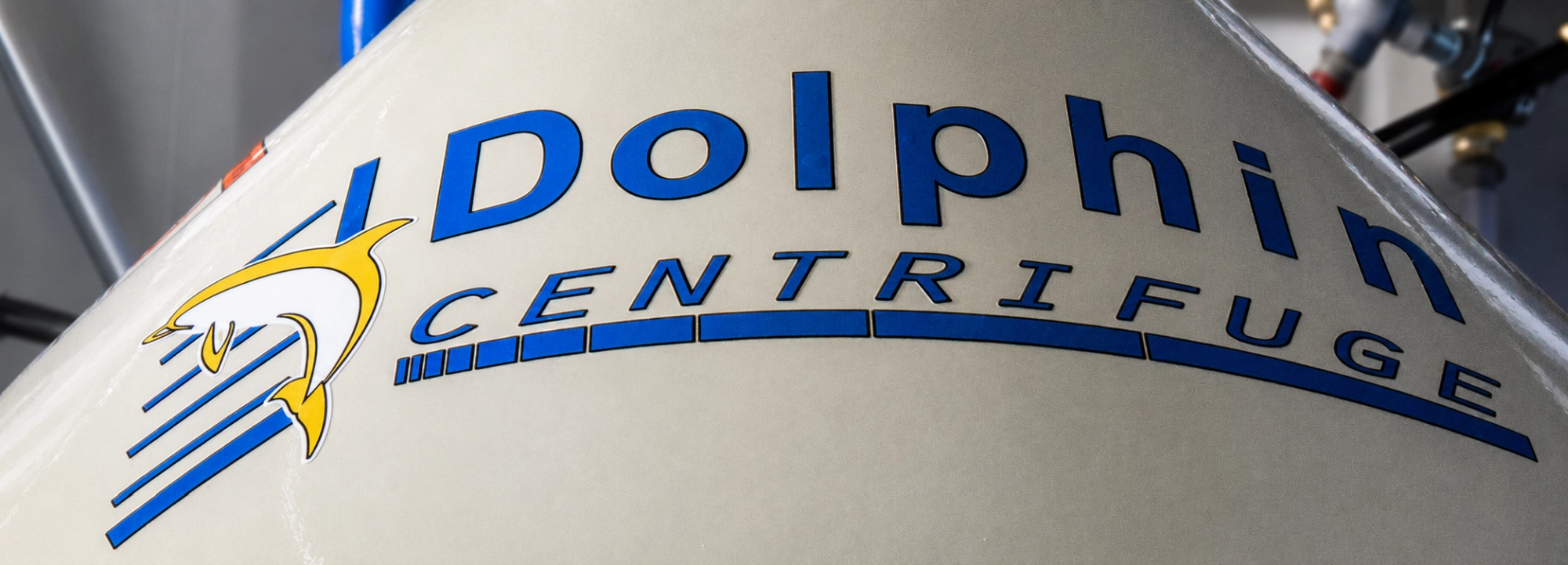 Dolphin Centrifuge logo close-up on an industrial centrifuge bowl