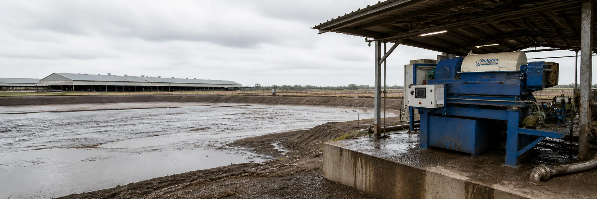 Manure centrifuge separator installed beside a livestock manure lagoon